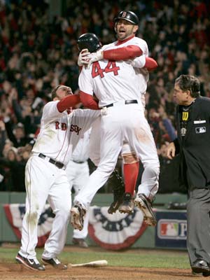 Boston Red Sox (L to R) Mark Kotsay, Jason Varitek and Jason Bay celebrate after Bay scored the game winning run against the Los Angeles Angels during the ninth inning in Game 4 of their MLB American League Division Series baseball playoff at Fenway Park in Boston, Massachusetts, October 6, 2008.