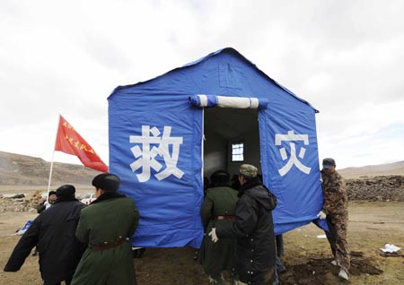Armed police set up tents for local residents in Gedar Township of Damxung County in southwest China&apos;s Tibet Autonomous Region, on Oct. 7, 2008. 