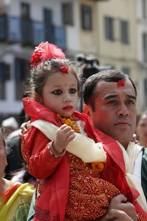 The new Living Goddess Kumari arrives at Kumari Gahar in Kathmandu, Nepal, Oct. 7, 2008. Three-year-old Matina Shakya took her seat as the Living Goddess at Kumari Ghar on Tuesday. (Xinhua/Bimal Gautam)