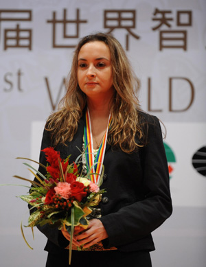 Stefanova Antoaneta of Bulgaria listens to the national anthem during the awarding ceremony for the women's chess individual rapid in the First World Mind Sports Games in Beijing, capital of China, Oct. 8, 2008. Stefanova defeated China's Zhao Xue 2-0 and claimed the title. 
