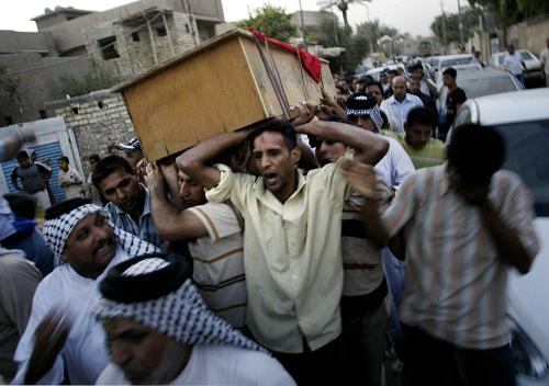 carry the coffin of Iraqi parliament member Salen al-Ugaili during his funeral on October 9, 2008 in the Sadr city district in Baghdad, Iraq. Al-Ugaili, who was a moderate member of parliament from the Shiite cleric Moqtada al-Sadr's block, was killed on October 9, 2008 when a bomb exploded near his car in the Sadr city district east of Baghdad, Iraq. [Xinhua]