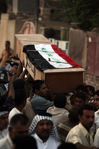 Relatives and friends of assassinated Iraqi anti-American Sadrist Member of Parliament Saleh al-Okaili (al-Ogayly) carry his coffin during his funeral in Baghdad on October 9, 2008. Okaili (Ogayly) was assassinated in a bomb attack today in Baghdad's Shiite stronghold of Sadr City, marking the first killing of a MP in 18 months, his radical Sadrist faction said. [Xinhua]