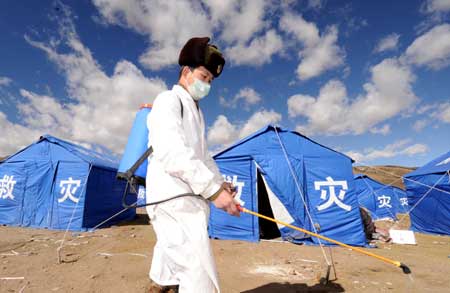 Epidemic prevention worker disinfects near the relief tents in Yangyi Village of Gedar Township in Damxung County, an outer county of Lhasa, capital of southwest China&apos;s Tibet Autonomous Region, Oct. 10, 2008. 