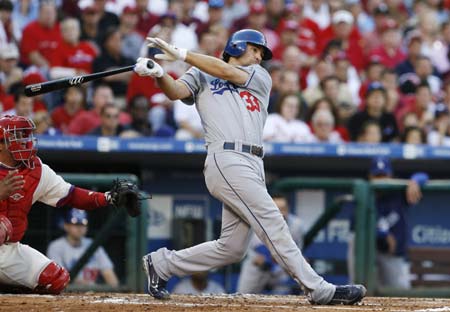 Los Angeles Dodgers Blake DeWitt hits an RBI sacrifice against the Philadelphia Phillies in the second inning during Game two of Major League Baseball's NLCS playoff series in Philadelphia October 10, 2008.[Xinhua Photo]