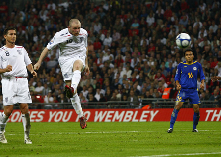 England's Wayne Rooney (2nd L) heads and scores a goal against Kazakhstan during their 2010 World Cup qualifying soccer match at Wembley Stadium in London October 11, 2008.