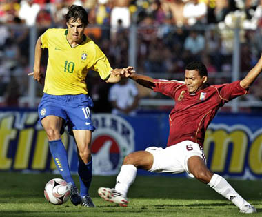 Venezuela's Pedro Boada, right, tries to stop Brazil's Kaka during a 2010 World Cup qualifying game in San Cristobal, Venezuela, yesterday.