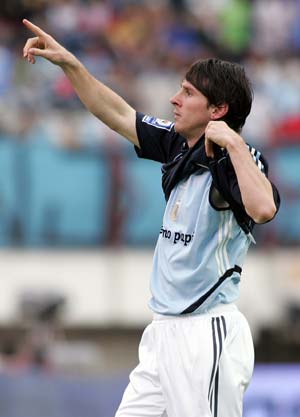 Argentina's Lionel Messi celebrates after scoring during the FIFA World Cup 2010 qualifying football match against Uruguay held in Buenos Aires, capital of Argentina, October 11, 2008. Argentina won 2-1. [Martin Zabala/Xinhua]
