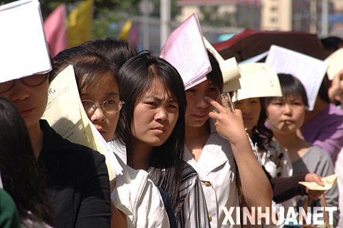 University graduates queue for a job fair in Beijing on October 8, 2008.