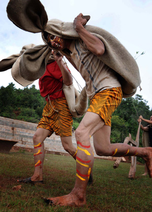 Local people imitating tigers perform during the traditional Nuo ritual to exorcise evil spirits and pray for happiness in Shuangbai county, Yi Autonomous Prefecture of Chuxiong, southwest China&apos;s Yunnan Province, Oct. 10, 2008. 