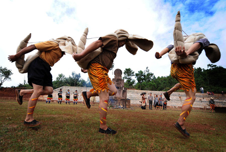 Local people imitating tigers perform during the traditional Nuo ritual to exorcise evil spirits and pray for happiness in Shuangbai county, Yi Autonomous Prefecture of Chuxiong, southwest China&apos;s Yunnan Province, Oct. 10, 2008.