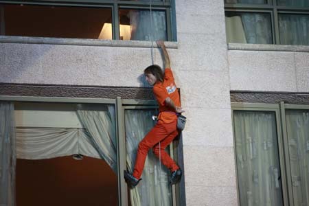 French 'Spiderman' Alain Robert climbs the facade of the InterContinental Hotel Phoenicia in Beirut October 11, 2008.