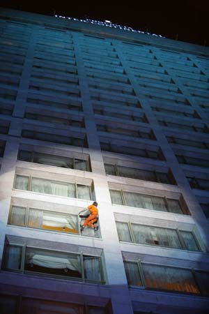 French "Spiderman" Alain Robert climbs the facade of the InterContinental Hotel Phoenicia in Beirut October 11, 2008.