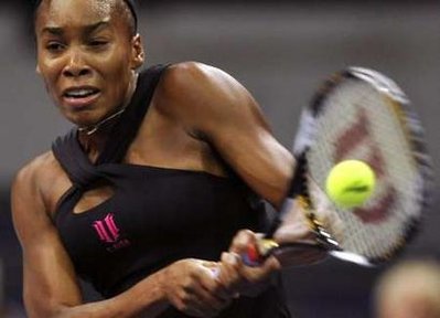 Venus Williams of the U.S. returns the ball during her first round match against Ukraine's Alona Bondarenko at the WTA Zurich Open tennis tournament at the Hallenstadion in Zurich on Wednesday, October 15, 2008. [Reuters]