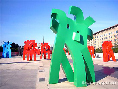 Sculptures stand on the China Millennium Monument Square in Beijing, October 15, 2008. A solo exhibition of 78 sculptures by Chinese artist Liu Yonggang started on Tuesday, China’s largest and longest modern sculpture exhibition. The show will last almost one month until November 12, 2008. [Asianewphoto]