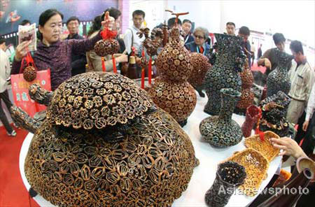 Craftworks made of walnut are seen at the 6th China International Agricultural Product Trade Fair in the National Agriculture Exhibition Center in Beijing, October 15, 2008. [Photo: Asianewsphoto]