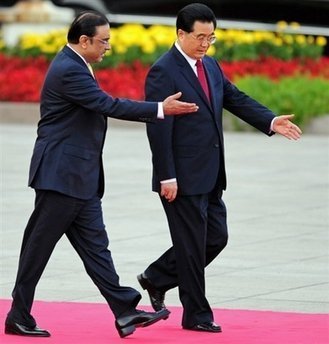 Chinese President Hu Jintao greets his Pakistani counterpart Asif Ali Zardari during a welcoming ceremony attend a ceremony at the Great Hall of the People in Beijing October 15, 2008. [Agencies