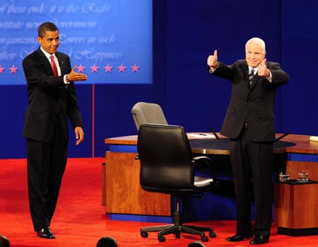 US Democratic presidential candidate Sen. Barack Obama (L) and Republican presidential candidate Sen. John McCain greet the spectators after their last presidential debate at Hofstra University in Hempstead Oct. 15, 2008.