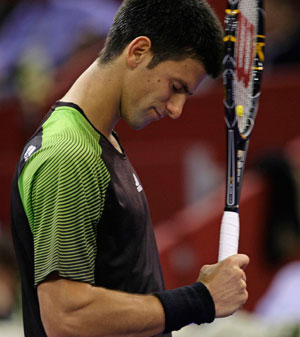 Novak Djokovic of Serbia gestures during his match against Ivo Karlovic of Croatia at the Madrid Masters Series tennis tournament in Madrid October 16, 2008. [Xinhua/Reuters]