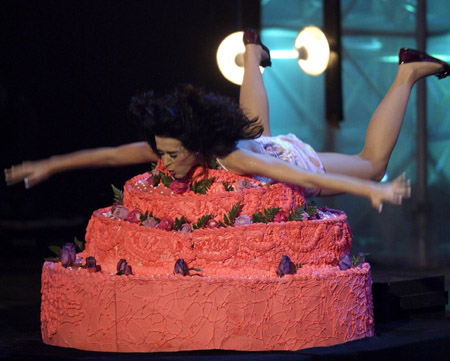 U.S. singer Katy Perry dives onto a cake while performing at the MTV Latin America Awards in Guadalajara, October 16, 2008. 
