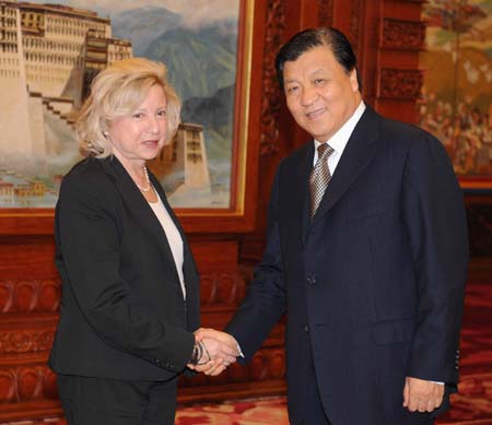 Liu Yunshan(R), head of the Communist Party of China (CPC) Central Committee Publicity Department, shakes hands with Coletter Avital, head of visiting delegation from the Israel Labor Party (ILP), during their meeting in Beijing, capital of China, on Oct. 17, 2008.