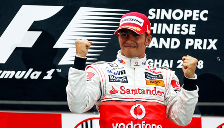 McLaren-Mercedes team's Lewis Hamilton of Britain celebrates his victory during the F1 Chinese Grand Prix at the Shanghai International Circuit in Shanghai, east China, on Oct. 19, 2008.[Fan Jun/Xinhua]