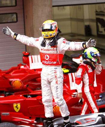 McLaren-Mercedes team's Lewis Hamilton of Britain celebrates his victory during the F1 Chinese Grand Prix at the Shanghai International Circuit in Shanghai, east China, on Oct. 19, 2008.[Fan Jun/Xinhua]