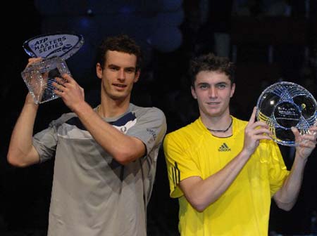 British tennis player Andy Murray (L) and French Gilles Simon hold the trophies during the awarding ceremony at the Masters Madrid in Madrid, Spain, on Sunday Oct. 19, 2008. [Xinhua/Reuters] 