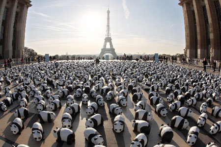 A panda parade : Paper mache pandas set up by members of the World Wildlife Fund are pictured on the Parvis des droits de l'Homme at Paris Trocadero esplanade to symbolize the 1,600 pandas left on earth and to call people to do their part in helping to reverse the deterioration of our natural environment. [Xinhua/AFP] 