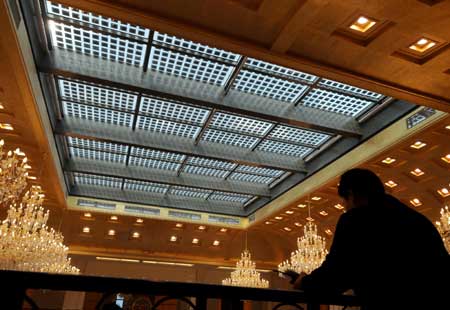 Photo taken on Oct. 18, 2008 shows a solar glass curtain wall in Diangujinjiang International Hotel of Baoding in north China's Hebei Province. The five-star hotel with solar power generators, the first of its kind in China, was put into operation on Saturday, which has a total installed solar power capacity of 0.3 megawatts. [Xinhua] 