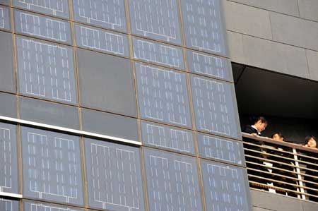 Photo taken on Oct. 18, 2008 shows a solar glass curtain wall at Diangujinjiang International Hotel of Baoding in north China's Hebei Province. The five-star hotel with solar power generators, the first of its kind in China, was put into operation on Saturday, which has a total installed solar power capacity of 0.3 megawatts. [Xinhua]
