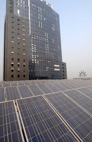 Photo taken on Oct. 18, 2008 shows solar power systems at Diangujinjiang International Hotel of Baoding in north China's Hebei Province. The five-star hotel with solar power generators, the first of its kind in China, was put into operation on Saturday, which has a total installed solar power capacity of 0.3 megawatts. [Xinhua] 