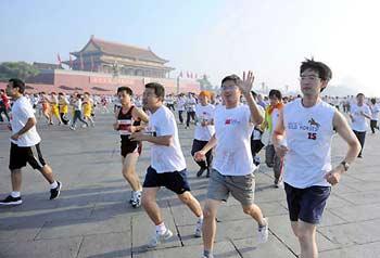 Runners pass the Tian'anmen Square during the HYX Beijing International Marathon, October 19, 2008. Nearly 30,000 participants took part in this annual marathon event.[Xinhua] 