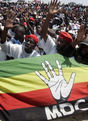 Supporters of Zimbabwe's opposition party Movement For Democratic Change (MDC) chant party slogans at a rally in Masvingo, some 300 km (186 miles) south-east of of the capital Harare, October 19, 2008. 