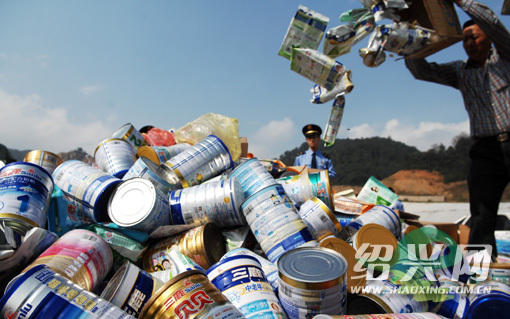 Local authorities of Shaoxing, east China's Zhejiang Province, destroy contaminated dairy products on October 17, 2008. 