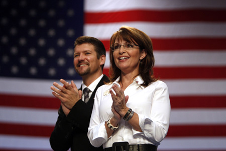 U.S. Republican vice presidential nominee Alaska Governor Sarah Palin and her husband Todd attend at a rally in Virginia Beach, Virginia October 13, 2008. 