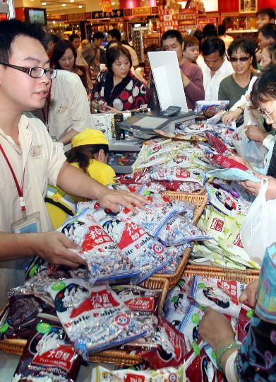 A new batch of White Rabbit milk candies restocked supermarket shelves in Beijing on Thursday, October 23, 2008. The new candies, made from quality milk powder, have been sealed in new packages tagged with a green mark exclaiming 'melamine-free product, safe to consume.' The candy's producer, the Guanshengyuan Company, halted all sales of White Rabbit Candy and recalled all domestic and overseas products immediately after the candy tested positive for melamine. 