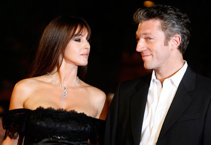 Italian actress Monica Bellucci pose on the red carpet with her husband French actor Vincent Cassel at the premiere of her latest movie 'L'Uomo che ama' (The Man Who Loves) at Rome's Film Festival October 23, 2008.