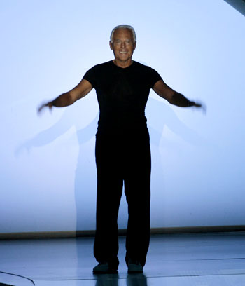 Italian designer Giorgio Armani acknowledges applause at the end of Emporio Armani Spring/Summer 2009 women's collection during Milan Fashion Week September 21, 2008.