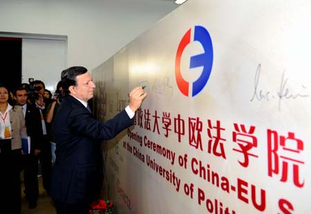 European Commission President Jose Barroso signs during the opening ceremony of China-EU School of Law at the China University of Political Science and Law in Beijing, China, on Oct. 24, 2008.