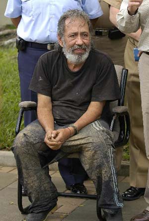 Freed Colombian hostage and former congressman Oscar Tulio Lizcano gestures after arriving at a military base in Cali, Colombia, Sunday, Oct. 26, 2008.