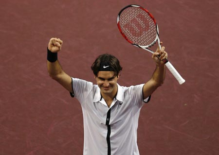 Switzerland's Roger Federer celebrates his victory over Argentina's David Nalbandian in their final match at the Swiss Indoors ATP tennis tournament in Basel October 26, 2008.