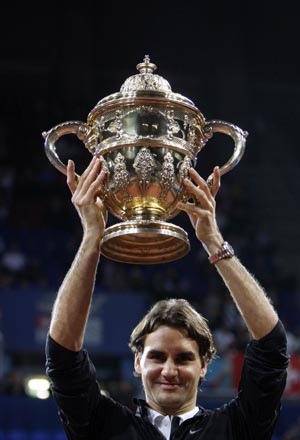 Switzerland's Roger Federer holds his trophy after his victory over Argentina's David Nalbandian in their final match at the Swiss Indoors ATP tennis tournament in Basel October 26, 2008.