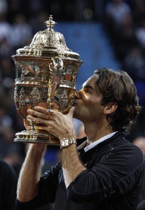 Switzerland's Roger Federer kisses his trophy after his victory over Argentina's David Nalbandian in their final match at the Swiss Indoors ATP tennis tournament in Basel October 26, 2008.
