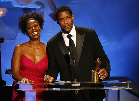 Actor Denzel Washington and his wife Pauletta accept the Brass Ring award at the 30th Carousel of Hope gala in Beverly Hills, California October 25, 2008. The evening benefits the Barbara Davis Center for Childhood Diabetes.