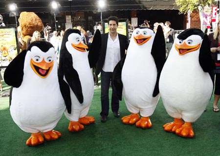 Cast member David Schwimmer (C), who gives voice to Melman, poses with characters from the movie at the premiere of 'Madagascar: Escape 2 Africa' at the Mann Village theatre in Westwood, California October 26, 2008.