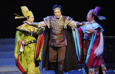 Chinese theatrical performers perfom opera Turandot in Cairo Opera House, downtown Cairo, capital of Egypt on Oct. 26, 2008. The scene shows Ministers Pang(R) and Pong (L) try to stop the young prince of Tartary (M) from answering Princess Turandot's three ridlles, in the world famous opera Turandot which was staged in Cairo Opera House, downtown Cairo, capital of Egypt on Oct. 26, 2008. The opera, given by China National Opera House, would be performed four nights in Cairo.