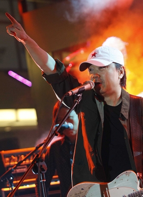 Cui Jian performs at an outdoor live concert held in Shanghai, October 26, 2008.