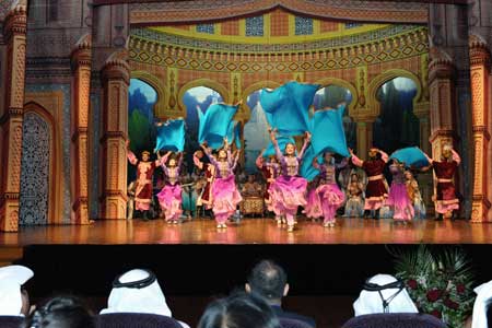 Actors from China&apos;s Xinjiang Mukam Art Troupe show Chinese ethnic culture during their performance in Doha, Qatar Oct. 26, 2008. 