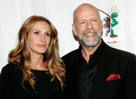 Actor Bruce Willis and actress Julia Roberts arrive for a staged reading of 'The World of Nick Adams,' at Davies Symphony Hall in San Francisco, California October 27, 2008.