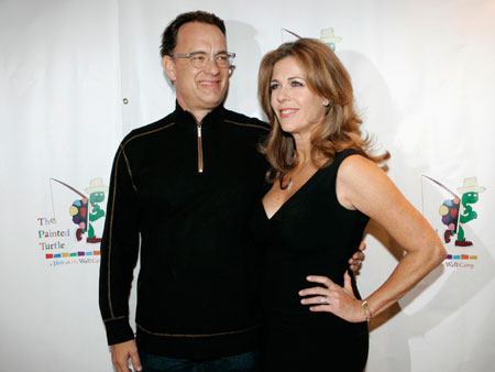 Actor Tom Hanks and his wife, actress Rita Wilson, pose for photographers as they arrive for a staged reading of 'The World of Nick Adams,' at Davies Symphony Hall in San Francisco, California October 27, 2008.